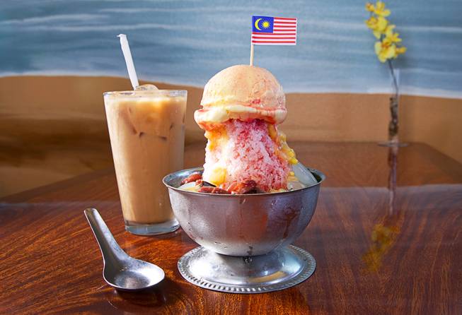 Ice Kacang with Ice Cream (Ice cream over shaved ice with red bean, corn, palm seeds, jelly, red rose syrup and evaporated milk - $5.50) at Island Malaysian Cuisine in the Pacific Asian Plaza, 5115 Spring Mountain Rd., Tuesday, Aug. 19, 2014. Pictured with sweet Malaysian iced tea.