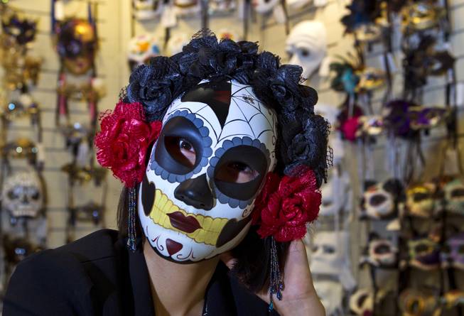 Joy Pan wears one of her dynamic masks from the KBW Global Corp. during the MAGIC Marketplace Fall Show at the Las Vegas Convention Center on Tuesday, August 19, 2014.