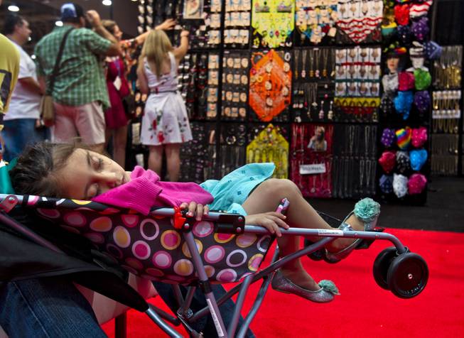 Valeria Reyes, 1, takes an afternoon nap during the MAGIC Marketplace Fall Show at the Las Vegas Convention Center on Tuesday, August 19, 2014.