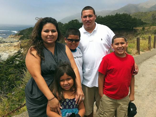 This undated photo provided by the Barajas family shows from left, Cindy Barajas, Jenessah Barajas, Caleb Barajas, David Barajas and David Barajas Jr. Caleb and David Jr. were killed during a Dec. 7, 2012, accident near their home in Alvin, Texas, as the boys and their father were pushing their truck on a rural road after it had broken down. 