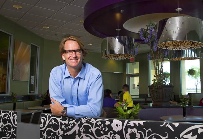 James Vance, owner-operator of eight local McDonald's franchises, poses in his McDonald's at 6990 S. Rainbow Blvd. Wednesday, Aug. 20, 2014. Vance is also president of the Greater Las Vegas McDonalds Owner Operators Association. Since 1999, the local effort has awarded more than $3.1 million in Ronald McDonald House Charities scholarships, helping more than 1,300 Southern Nevada high school students.