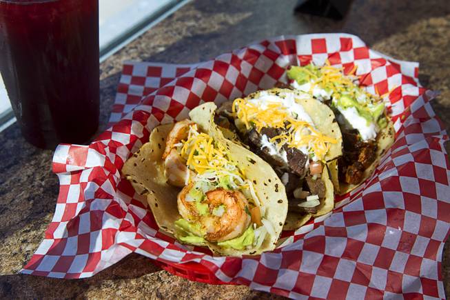 A Taco Trio (shrimp, carne asada and adobada tacos), served with rice and refried beans, at Saborr, a Mexican fast food restaurant at 4348 E. Craig Rd., Thursday, Aug. 21, 2014.