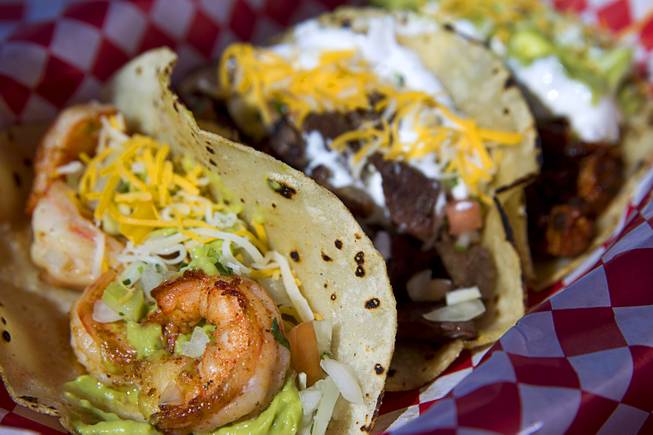 A Taco Trio (shrimp, carne asada and adobada tacos), served with rice and refried beans, at Saborr, a Mexican fast food restaurant at 4348 E. Craig Rd., Thursday, Aug. 21, 2014.