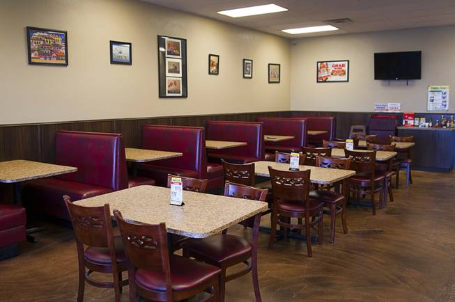 A dining area is shown at Saborr, a Mexican fast food restaurant at 4348 E. Craig Rd., Thursday, Aug. 21, 2014.