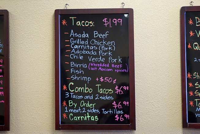 A taco menu is shown at Saborr, a Mexican fast food restaurant at 4348 E. Craig Rd., Thursday, Aug. 21, 2014.