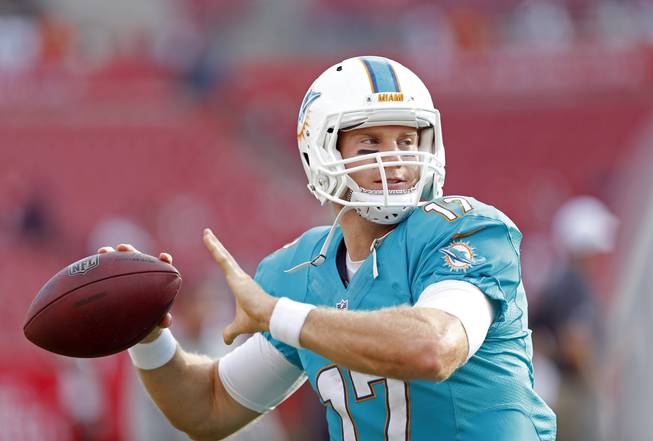 Miami Dolphins quarterback Ryan Tannehill (17) warms up before the start of an NFL preseason football game against the Tampa Bay Buccaneers Saturday, Aug. 16, 2014, in Tampa, Fla. 