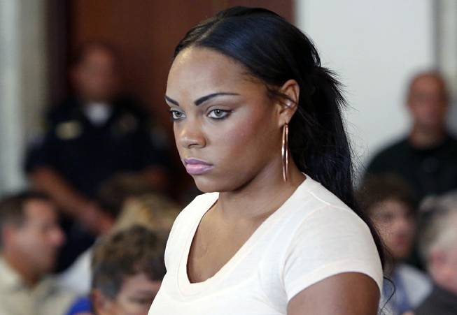 In this July 24, 2013, file photo, Shayanna Jenkins, fiancee of former New England Patriots NFL football player Aaron Hernandez, arrives at a hearing for Hernandez at Attleboro District Court in Attleboro, Mass. Her lawyers filed a motion Thursday, Aug. 14, 2014, in county court in Fall River, Mass., seeking to have perjury charges dismissed. 