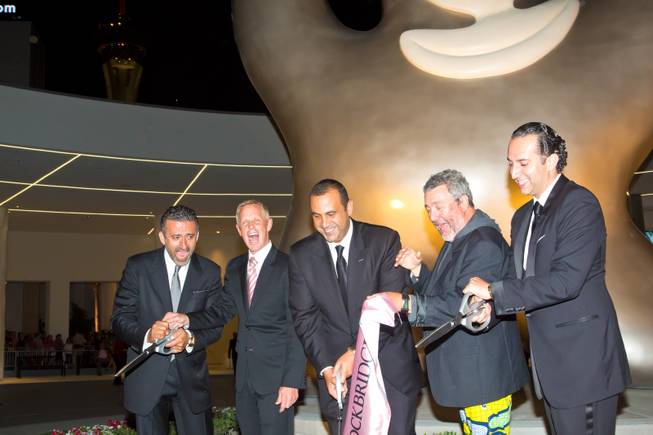 SBE partners cut the ceramonial ribbon at SLS Las Vegas during the grand-opening celebration Saturday, Aug. 23, 2014, on the Strip.