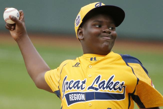 Chicago's Joshua Houston delivers in the first inning of a United States Championship game against Las Vegas at the Little League World Series tournament in South Williamsport, Pa., Saturday, Aug. 23, 2014. (AP Photo/Gene J. Puskar)
