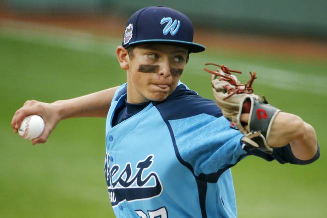 Las Vegas' Brennan Holligan (27) delivers in the first inning of the United States Championship game against Chicago  at the Little League World Series tournament in South Williamsport, Pa., Saturday, Aug. 23, 2014. (AP Photo/Gene J. Puskar