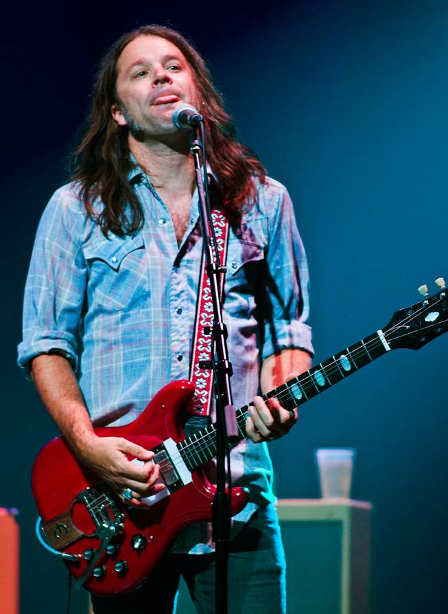 Andrew McKeag with Presidents of the United States of America sticks out his tongue as he plays at the House of Blues in the Mandalay Bay on Saturday, August 23, 2014.