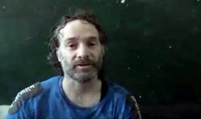 In this image made from undated video obtained by The Associated Press, which has been authenticated based on its contents and other AP reporting, a man believed to be Peter Theo Curtis, a U.S. citizen held hostage by an al-Qaida linked group in Syria, delivers a statement. The U.S. government said on Sunday, Aug. 24, 2014 that Curtis, who had been held hostage for about two years, had been released.