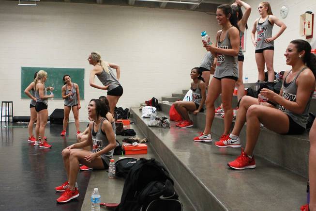 UNLV Rebel Girls take a quick water break during practice Tuesday, Aug. 19, 2014.
