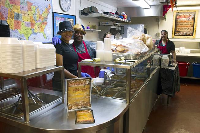 Star Alexander, left, and Melvin Morgan pose behind the counter at the Road Kill Grill, 3730 Thom Blvd., Monday, Aug. 25, 2014.