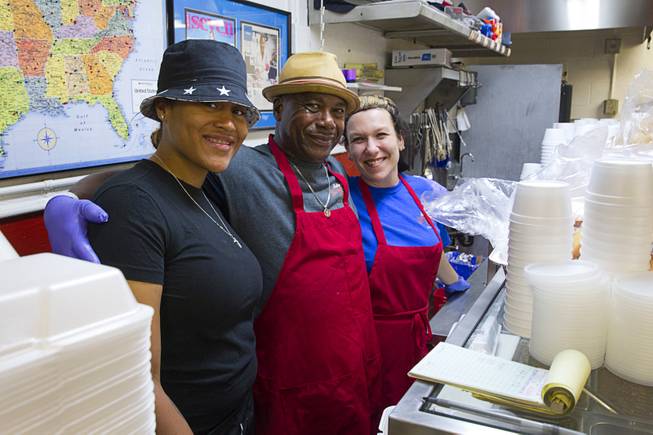 Star Alexander, left, Melvin Morgan and Jeana Waple pose behind the counter at the Road Kill Grill, 3730 Thom Blvd., Monday, Aug. 25, 2014.