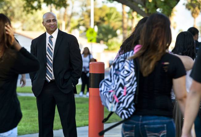 Chaparral High School Principal Lolo James watches students stream by as he begins his first day as the top administrator there, Aug. 25, 2014. A new master’s program in educational leadership will train and prepare principals for the challenges they’ll face in Las Vegas today.