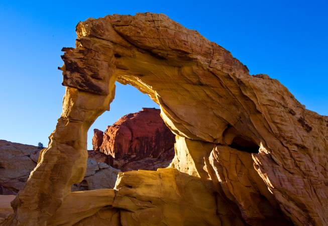 An arch near the White Domes within the Valley of Fire State Park catches a late-day sun on Saturday, February 1, 2014.