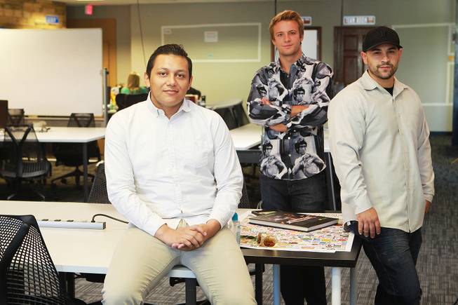 Marcos Ontiveros, Blaze Brooks and Evan Savar have collaborated to create the anti-bullying app "Bully Alert," and are seen in their new workspace Wednesday, Aug. 27, 2014.