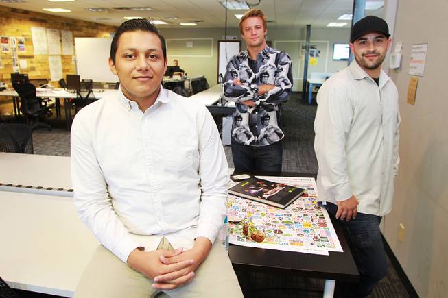Marcos Ontiveros, Blaze Brooks and Evan Savar, who have collaborated to create the anti-bullying app "Bully Alert," are seen in their new workspace Wednesday, Aug. 27, 2014.