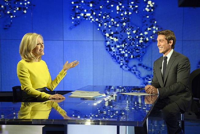 Diane Sawyer signs off on her last broadcast as anchor of "World News" in New York on Wednesday, Aug. 27, 2014. Sawyer told viewers that it has been wonderful to be the "home port" of the network's news team each weeknight. David Muir, right, will become anchor and managing editor of the program in September. 