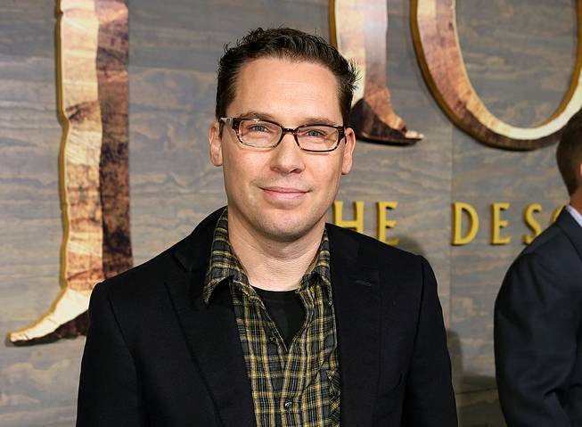 This Dec. 2, 2013, file photo shows Bryan Singer at the Los Angeles premiere of "The Hobbit: The Desolation of Smaug" at Dolby Theater. A former child model accusing “X-Men” director Singer of sex abuse in Hawaii said he wants to dismiss the lawsuit — not because it lacks merit but because he can’t find a new attorney to represent him. 