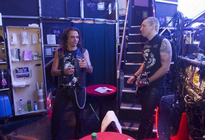Guitarists Chris Cucchino, left, and Andy Gerold wait backstage before a performance of "Rock Of Ages" at the Venetian Wednesday, Aug. 27, 2014. 