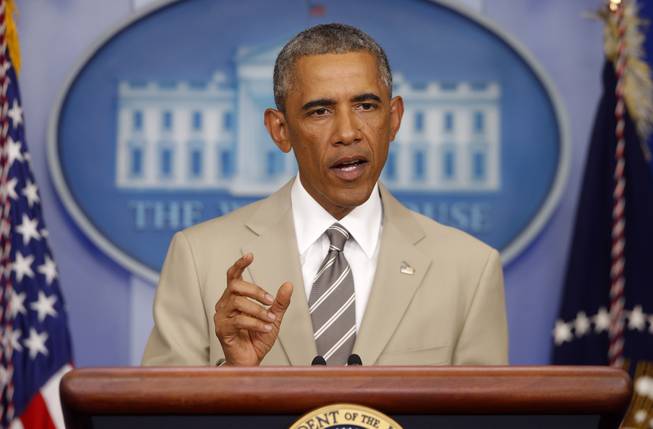 President Barack Obama speaks the economy, Iraq, and Ukraine, Thursday, Aug. 28, 2014, in the James Brady Press Briefing Room of the White House in Washington, before convening a meeting with his national security team on the militant threat in Syria and Iraq.