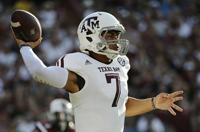 Texas A&M quarterback Kenny Hill throws against South Carolina during the first half of an NCAA college football game on Thursday, Aug. 28, 2014, in Columbia, S.C. 
