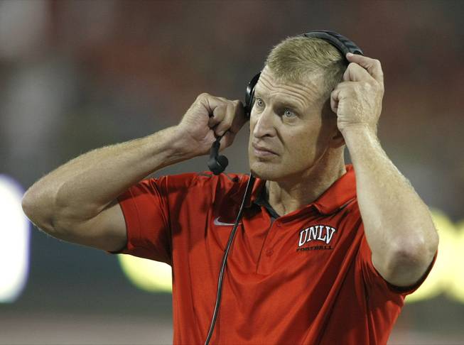 UNLV head coach Bobby Hauck during the first half of an NCAA football game against Arizona on Friday, Aug. 29, 2014, in Tucson, Ariz.