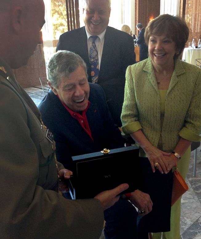 Jerry Lewis is shown with his wife, Sam, and son Chris at the Smith Center for the Performing Arts on Friday, Aug. 29, 2014, as he is shown his Member of the Order of Australia medal, which is the highest civilian honor awarded by that country. Lewis was recognized for his work with the Muscular Dystrophy Foundation of Australia.