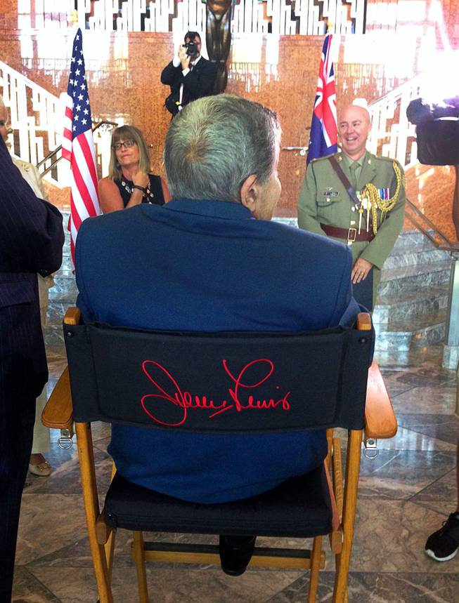 Jerry Lewis is shown in his famous director's chair at the Smith Center for the Performing Arts on Friday, Aug. 29, 2014, as he is admitted as a Member of the Order of Australia, the highest civilian honor awarded by that country. Lewis was recognized for his work with the Muscular Dystrophy Foundation of Australia.
