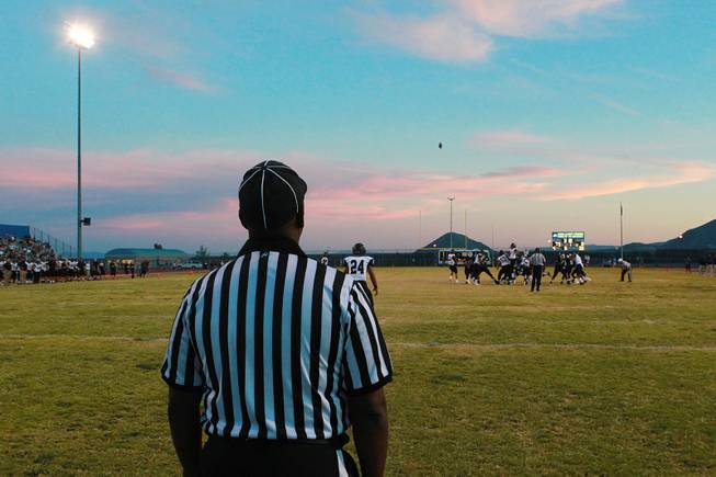 An official watches as Centennial attempts a field goal against Palo Verde during their game Friday, Aug. 29, 2014 at Centennial.