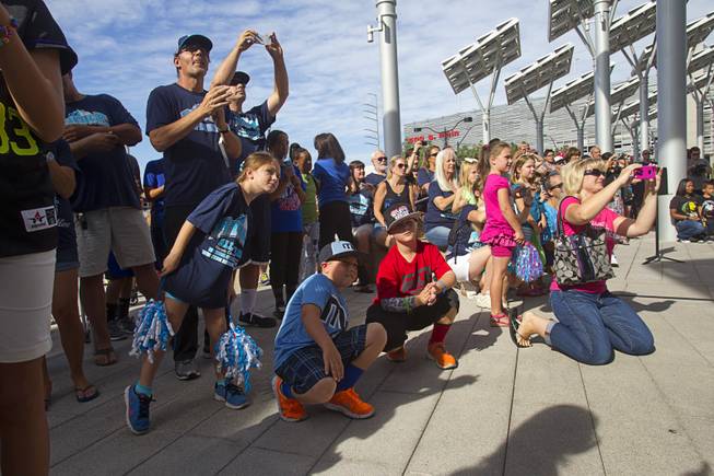 Family and friends attend a ceremony honoring the Mountain Ridge Little League team at Las Vegas City Hall Saturday, Aug. 30, 2014. After the ceremony, the team boarded an open-air Big Bus for a police-escorted parade down the Las Vegas Strip.