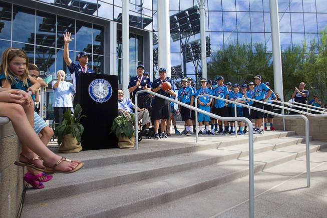  Mountain Ridge Little League manager Ashton Cave speaks during a ceremony honoring the Mountain Ridge Little League team at Las Vegas City Hall Saturday, Aug. 30, 2014. After the ceremony, the team boarded an open-air Big Bus for a police-escorted parade down the Las Vegas Strip.