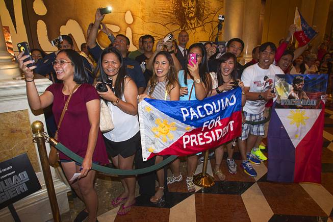 Manny Pacquiao fans wait for Pacquiao to pass by at the Venetian Saturday, Aug. 30, 2014. Pacquiao and his opponent Chris Algieri of Huntington, N.Y. are on day six of an international tour promoting their WBO welterweight title fight in Macau, China on November 22, 2014.