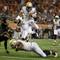 Photo: Florida State quarterback Jameis Winston leaps ove