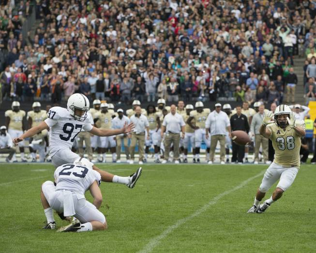 Penn State place kicker Sam Ficken kicks the game-winning field goal to beat Central Florida in the Croke Park Classic NCAA college football game in Dublin, Ireland, Saturday, Aug. 30, 2014. Penn State beat UCF, 26-24.
