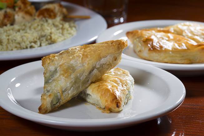 Spanakopita, left, and Tiropita are displayed at the E&N Family Table Restaurant, 4460 S. Durango Dr., Sunday, Aug. 31, 2014. Spanakopita is Greek savory pastry with spinach and feta cheese. Tiropita is the same but without the spinach.