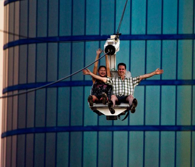 Riders gather some speed while taking on the Voodoo Zipline atop The Rio Hotel and Casino on Thursday, August 28, 2014.