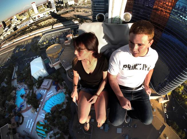 Kristy Depalo and Joe Gale enjoy their trip on the Voodoo Zipline atop The Rio Hotel and Casino on Thursday, August 28, 2014.