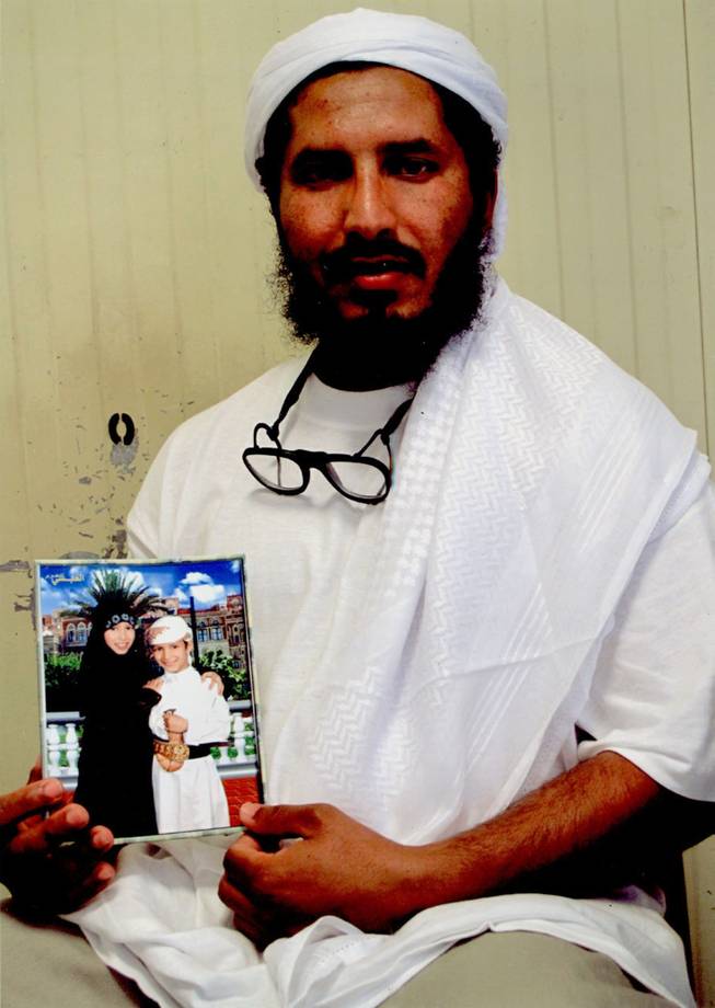 In this undated photo released by the family of Ahmed al-Darbi on Friday, Aug. 7, 2009, which was provided to them by the International Committee of the Red Cross, Guantanamo detainee Ahmed al-Darbi is seen at Camp 4 of the detention center on Guantanamo Bay Naval Base in Cuba. A Guantanamo Bay prisoner pleaded guilty Thursday to war crimes charges for helping plan the suicide bombing of an oil tanker off Yemen in 2002 that killed a crewman and wounded a dozen others. At an arraignment before a U.S. military judge, Ahmed al-Darbi of Saudi Arabia pleaded guilty to the five charges against him including terrorism, attacking civilians and hazarding a vessel for complicity in the al-Qaida attack on the French-flagged MV Limburg.