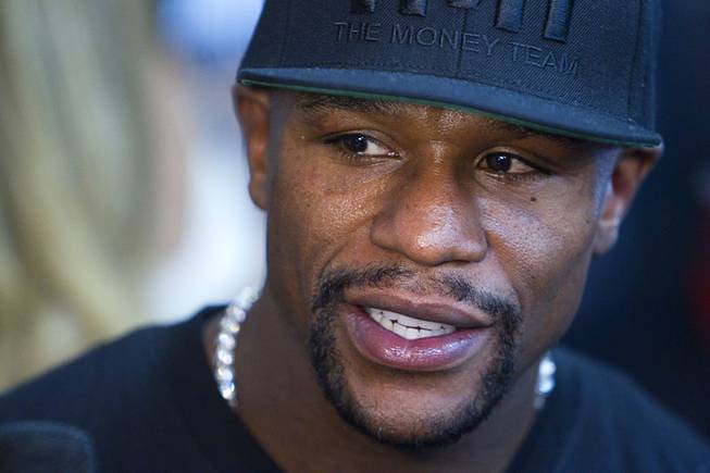 WBC/WBA welterweight champion Floyd Mayweather Jr. speaks with a reporter during a media day at the Mayweather Boxing Club Tuesday, Sept. 2, 2014. Mayweather will face Marcos Maidana of Argentina in a rematch at the MGM Grand Garden Arena on Saturday, Sept. 13.