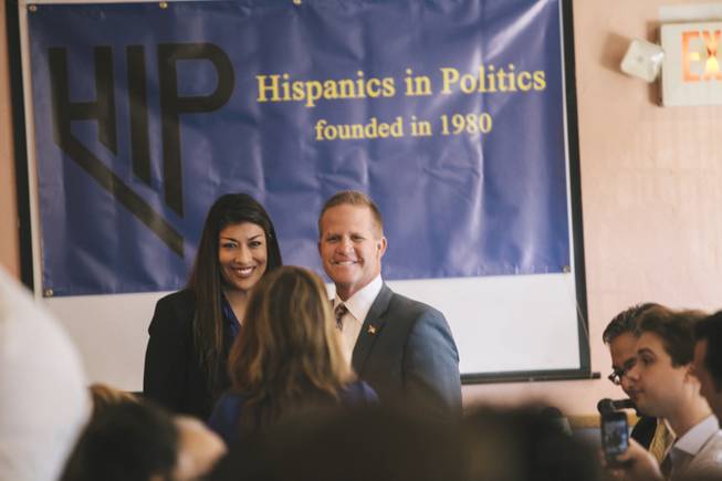 Nevada lieutenant governor candidates Lucy Flores and Mark Hutchison pose at their first public debate, hosted by Hispanics in Politics, Wednesday, Sept. 3, 2014. They fielded questions for a half-hour during an appearance on KRNV-TV's "Nevada Newsmakers" that was broadcast Tuesday, Sept. 30, 2014.