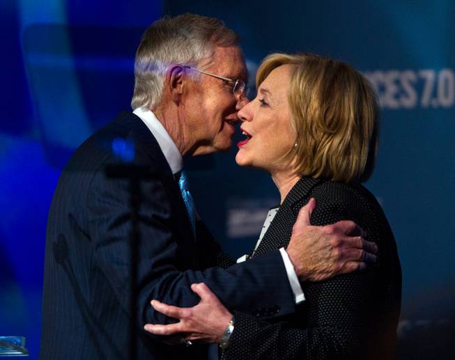 Senate Majority Leader Harry Reid and Former Secretary of State Hillary Rodham Clinton greet on stage before her talk during the Clean Energy Summit at the Mandalay Bay on Thursday, September 4, 2014.