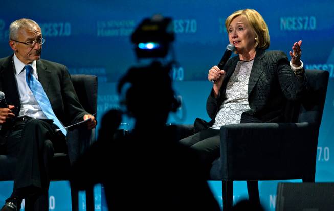 Former Secretary of State Hillary Rodham Clinton and White House adviser John Podesta talk energy together during the Clean Energy Summit at the Mandalay Bay on Thursday, September 4, 2014.