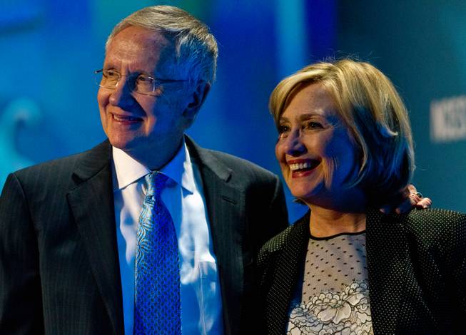 Senate Majority Leader Harry Reid and Former Secretary of State Hillary Rodham Clinton come together follower her talk during the Clean Energy Summit at the Mandalay Bay on Thursday, September 4, 2014.