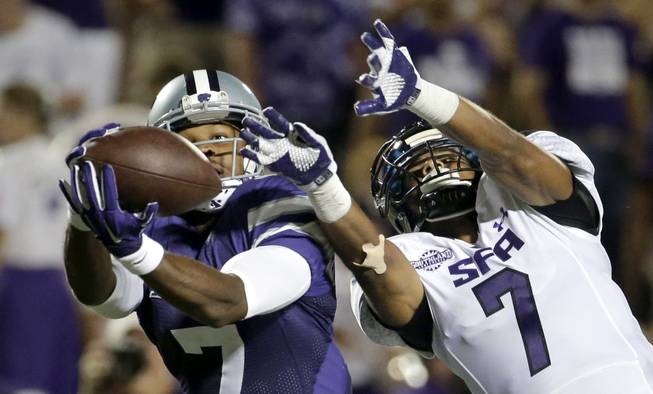 Stephen F. Austin defensive back Hipolito Coporan, right, breaks up a pass intended for Kansas State wide receiver Judah Jones, left, during the second half of an NCAA college football game Saturday, Aug. 30, 2014, in Manhattan, Kan. 