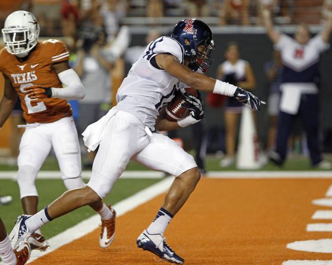 Mississippi receiver Evan Engram (17) scores a touchdown against Texas during the third quarter of an NCAA college football game Saturday, Sept. 14, 2013, in Austin, Texas.