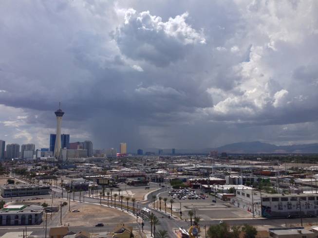 Storm clouds cover the valley, looking south from the Arts District, around 1 p.m. Sunday.
