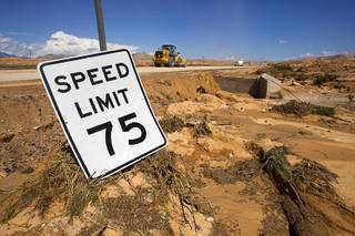 A speed limit sign is shown by the side of Interstate 15 near Moapa Tuesday, Sept. 9, 2014. About 1 mile of freeway was severely damaged by runoff from Monday's storm. The Nevada Department of Transportation expects to have two lanes open by the weekend, a spokesman said.